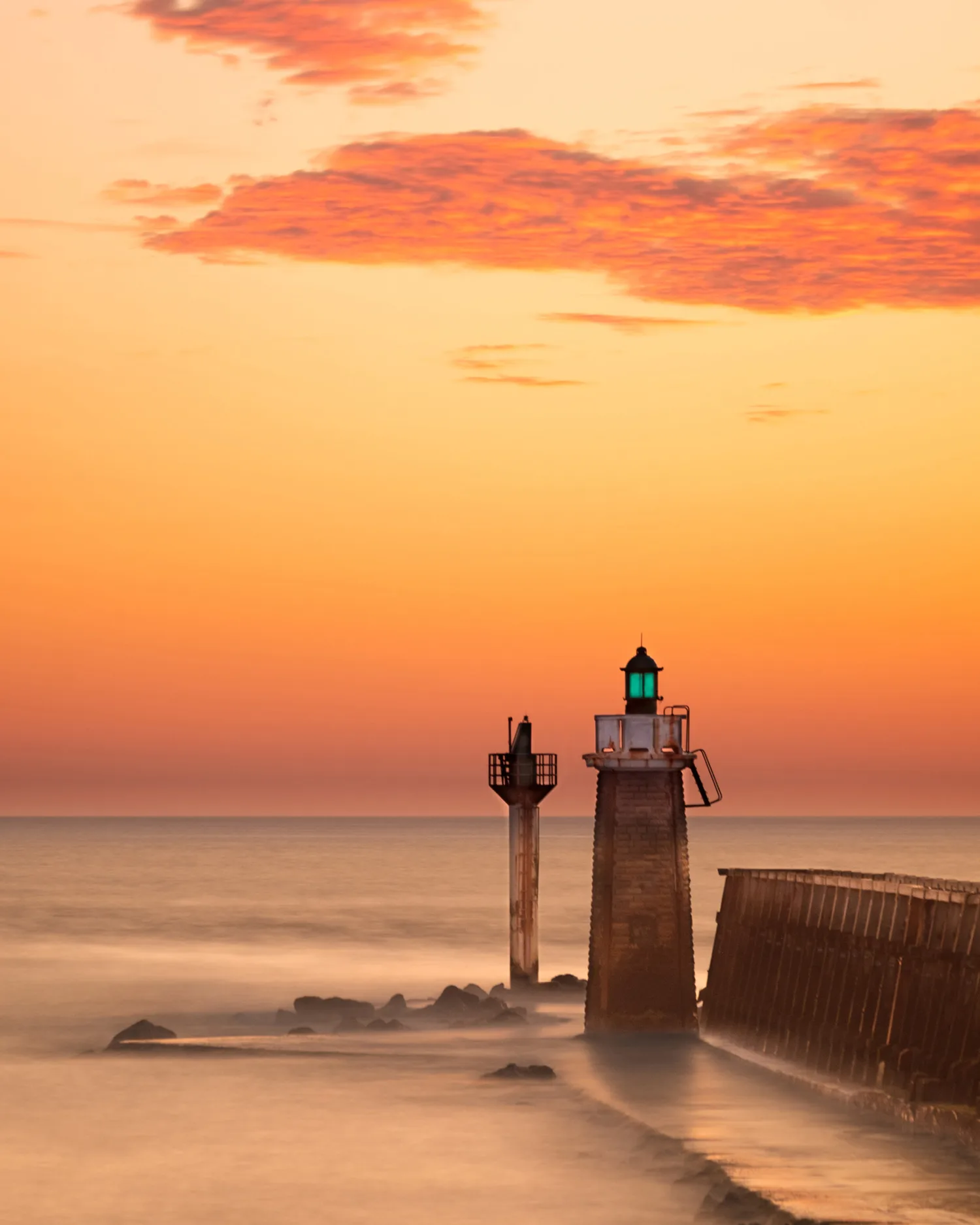 Coucher de soleil sur l'estacade et son phare